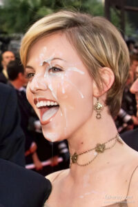 Cumshot fake of Charlize Theron in public wearing gold necklace and earings, with fake cum on her cheek and in her mouth, dripping down her chin.