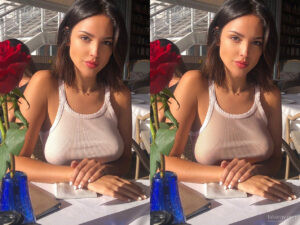 Eiza Gonzalez sitting in restaurant at the table, wearing see-through sexy white tank top.